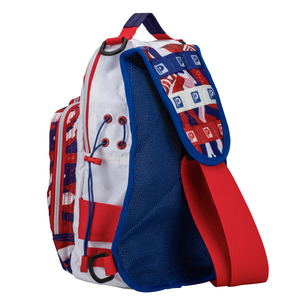 Red, white and blue sling backpack back angle showing padded blue mesh, wide red strap and strap pattern with repeated 'P' logos