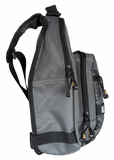Side view of Profishiency Alpha Pup sling bag with three zippered compartments, exterior pockets, visible zipper pulls, and adjustable sling strap