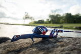 Side view of Americana Tangle-FREE Combo showcasing its blue, red, and white design on a lakeside rock