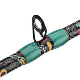Close-up side view of Profishiency KRAZY 3 baitcast rod guide with teal thread wraps and black guide ring on white background