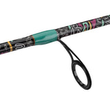 Spinning rod guide with black metal ring and teal thread wrap on a patterned blank (Krazy 3 Spin Combo)