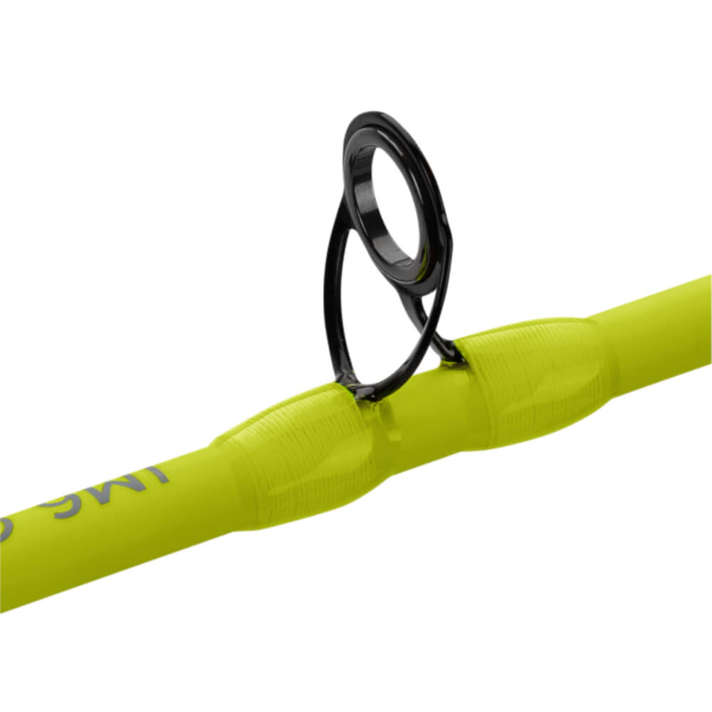 Black ceramic fishing-rod guide mounted on bright chartreuse ultralight rod blank, close-up view.