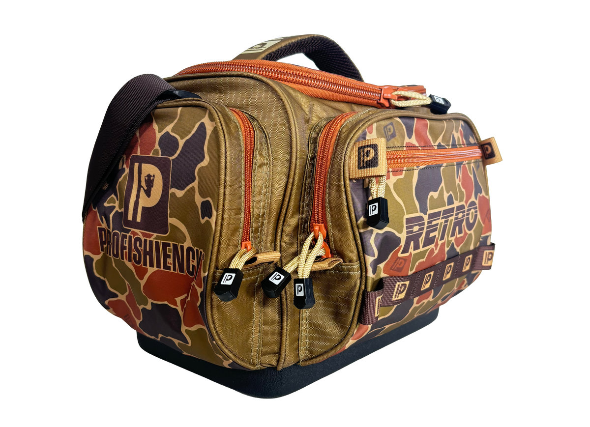 Three-quarter view of Profishiency Retro Green tackle bag showing multiple zippered compartments, MOLLE straps, molded base