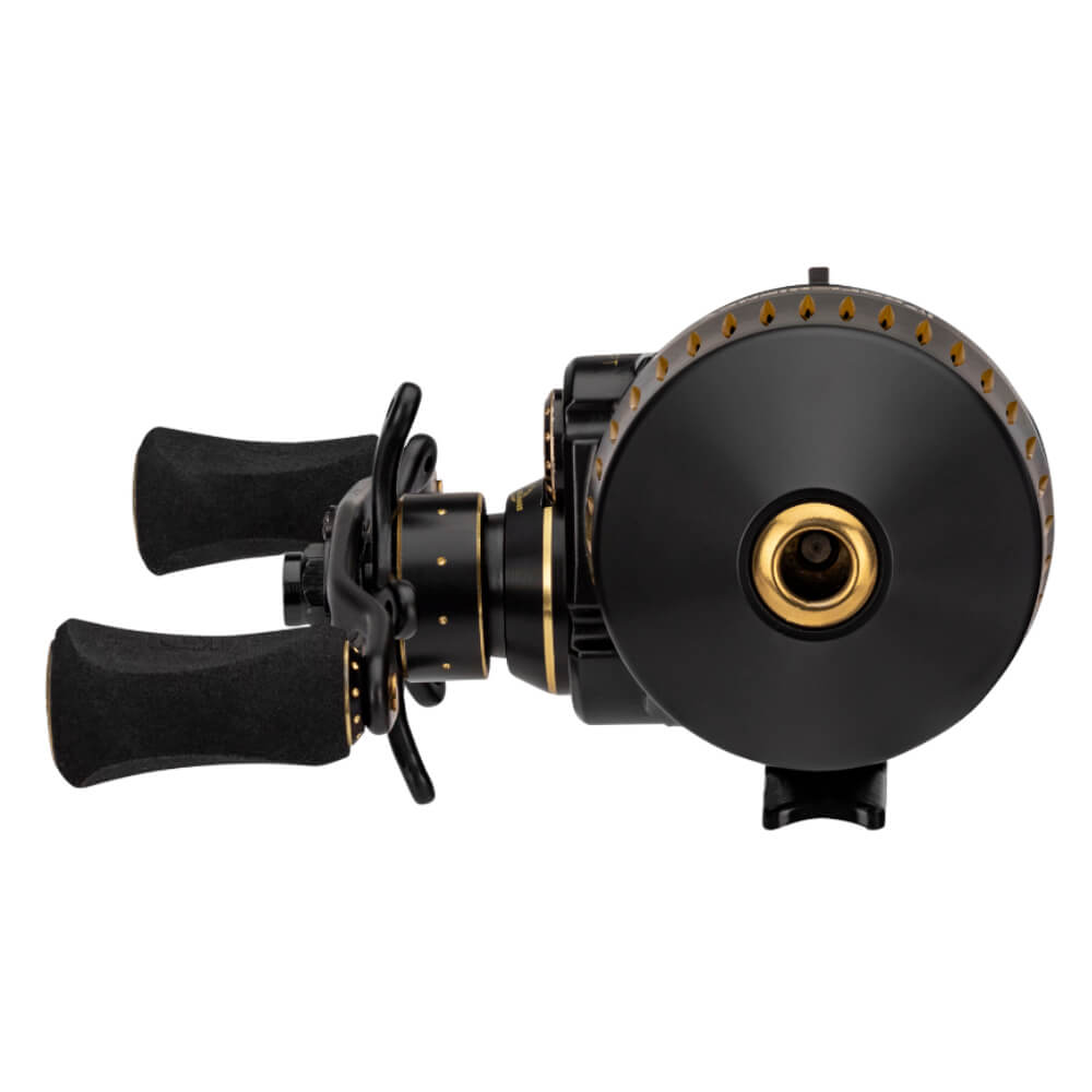 Front view of Profishiency SNIPER Spincast reel showing black finish with gold accents and dual EVA handles on white