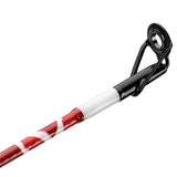 Close-up of Krazy Americana casting rod tip showing black guide and red-and-white striped blank on white background