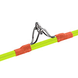 Close up of Teenage Mutant Ninja Turtle youth fishing pole showing metal line guide and orange thread wraps on neon green rod