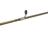 Olive-green fishing rod shaft close-up showing one black guide ring and a tapered light-wood handle insert