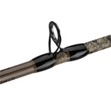 Close-up of spin-cast fishing rod guide and wrapped camo blank.