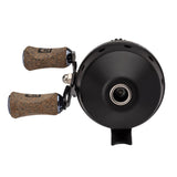 Black baitcasting reel, front view with twin cork handle knobs