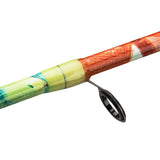 Close-up of Profishiency Krazy 2.0 spincast rod showing colorful patterned blank and single guide ring on white background